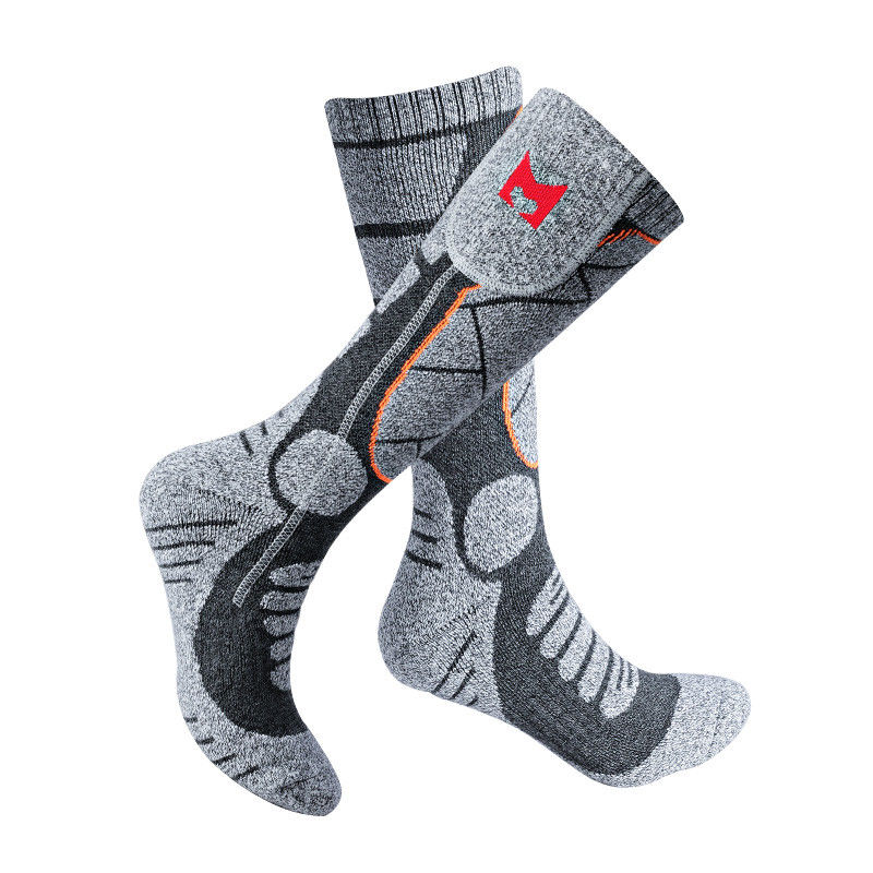 Le courant ascendant chaud de hausse à piles de chaussettes de femmes d'hommes a chauffé des chaussettes pour le temps froid